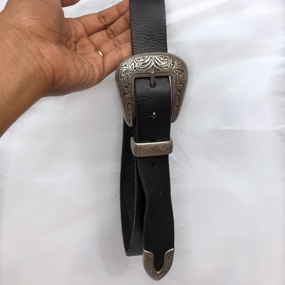Black belt with a beautiful buckle.